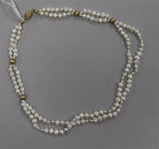 A double strand baroque cultured pearl necklace with 14ct gold clasp and spacers, 42cm.
